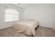 Bedroom with a large window allowing abundant natural light to illuminate the room at 5384 Knitmore Ct, Las Vegas, NV 89139