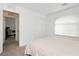 Bright bedroom featuring neutral carpet, a window with blinds, and a spacious closet at 5384 Knitmore Ct, Las Vegas, NV 89139
