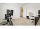 Bright room with carpet and white walls, ideal for a bedroom or exercise room with desk and exercise equipment at 5384 Knitmore Ct, Las Vegas, NV 89139