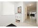 Welcoming entryway with shoe storage and bright natural light from the window at 5384 Knitmore Ct, Las Vegas, NV 89139