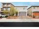 Charming two-story home featuring an attached two-car garage and a beautifully landscaped front yard at 5384 Knitmore Ct, Las Vegas, NV 89139