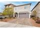 Charming two-story home featuring an attached two-car garage and a beautifully landscaped front yard at 5384 Knitmore Ct, Las Vegas, NV 89139