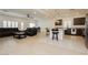 Open concept living space connects kitchen and seating area for modern living at 5384 Knitmore Ct, Las Vegas, NV 89139
