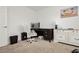 Carpeted office with a decorative chair, wooden desk, and white dresser for ample storage at 5384 Knitmore Ct, Las Vegas, NV 89139