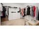 Spacious walk-in closet with shelving and a dresser, providing ample storage space at 5384 Knitmore Ct, Las Vegas, NV 89139