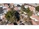 Aerial view of residential community with mature trees, walking paths, and lush landscaping in a well-maintained neighborhood at 5401 Tassara Way # 102, Las Vegas, NV 89108