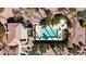 Aerial view of a community pool and spa with surrounding lounge areas and palm trees at 5401 Tassara Way # 102, Las Vegas, NV 89108