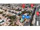 Overhead shot of the homes and neighborhood showcasing a community pool amenity at 5401 Tassara Way # 102, Las Vegas, NV 89108
