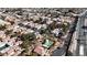 Birds-eye view of homes and the neighborhood, featuring a lovely community pool at 5401 Tassara Way # 102, Las Vegas, NV 89108