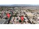 Wide aerial view of a neighborhood showcasing tree-lined streets, well-maintained homes, and proximity to local amenities and thoroughfares at 5401 Tassara Way # 102, Las Vegas, NV 89108