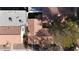 An aerial shot of a neighborhood showcasing the roof lines, landscaping, and property layouts at 5401 Tassara Way # 102, Las Vegas, NV 89108