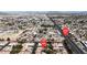 Overhead view of residential neighborhood with tree-lined streets, well-maintained homes, major street access, and mountain views at 5401 Tassara Way # 102, Las Vegas, NV 89108