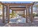 A community picnic area with a pergola, table, and chairs for outdoor enjoyment at 5401 Tassara Way # 102, Las Vegas, NV 89108
