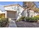 Charming single-story home with a well-maintained yard and stucco exterior at 5401 Tassara Way # 102, Las Vegas, NV 89108