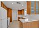 Functional kitchen space with tile flooring, white appliances and ample cabinet space at 5401 Tassara Way # 102, Las Vegas, NV 89108