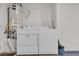 A laundry area with washer, dryer, and water heater at 5401 Tassara Way # 102, Las Vegas, NV 89108