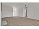Bright living room featuring plush carpeting and neutral walls at 5401 Tassara Way # 102, Las Vegas, NV 89108