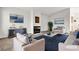 Stylishly staged living room featuring modern furniture and a cozy fireplace at 5401 Tassara Way # 102, Las Vegas, NV 89108