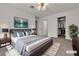Staged bedroom features a bed, two closets, and modern décor at 5401 Tassara Way # 102, Las Vegas, NV 89108