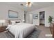 Staged bedroom features a bed, two closets, and modern décor at 5401 Tassara Way # 102, Las Vegas, NV 89108