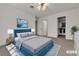 Staged bedroom features a bed, two closets, and modern décor at 5401 Tassara Way # 102, Las Vegas, NV 89108