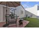 Outdoor patio with a shade umbrella, patio furniture, and artificial grass at 5401 Tassara Way # 102, Las Vegas, NV 89108