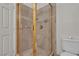 Bathroom featuring a glass shower with gold trim at 5401 Tassara Way # 102, Las Vegas, NV 89108