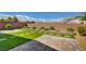 Beautiful backyard features turf, stone and colorful landscaping at 5518 Taylor Rose Ave, Las Vegas, NV 89139