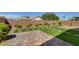 The backyard boasts low-maintenance turf and drought-tolerant landscaping at 5518 Taylor Rose Ave, Las Vegas, NV 89139