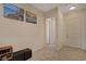Inviting entryway with neutral-toned walls, light-colored wood-look tile flooring, and artwork adorning the walls at 5518 Taylor Rose Ave, Las Vegas, NV 89139