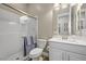 Bright bathroom with a glass-enclosed shower and a vanity with ample storage, ideal for a serene experience at 5523 Taylor Rose Ave, Las Vegas, NV 89139