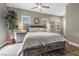 Comfortable bedroom with a large bed, stylish gray furniture, and plenty of natural light at 5523 Taylor Rose Ave, Las Vegas, NV 89139