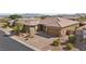 Charming single-story home with a tile roof, three-car garage, and desert landscaping at 5523 Taylor Rose Ave, Las Vegas, NV 89139