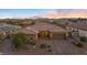 Beautiful single story home showcasing manicured landscaping, tile roof and a three car garage at 5523 Taylor Rose Ave, Las Vegas, NV 89139