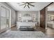 Primary bedroom showcasing barn door access to the bathroom, natural light and a ceiling fan at 5523 Taylor Rose Ave, Las Vegas, NV 89139