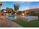 A luxurious pool and spa area, enhanced by fire features, offering a relaxing outdoor experience at 5523 Taylor Rose Ave, Las Vegas, NV 89139