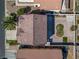 Aerial view of a home with a desert landscaped backyard, patio, and tile roof in a suburban neighborhood at 5854 Heather Marie Dr, Las Vegas, NV 89110