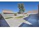 A gravel filled backyard with artificial turf at 5854 Heather Marie Dr, Las Vegas, NV 89110