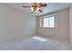 Bright bedroom with ceiling fan and window at 5854 Heather Marie Dr, Las Vegas, NV 89110