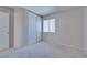 Neutral bedroom featuring carpet, window with blinds, and closet with sliding doors at 5854 Heather Marie Dr, Las Vegas, NV 89110