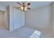 Bedroom featuring ceiling fan and closet at 5854 Heather Marie Dr, Las Vegas, NV 89110