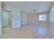 This large bedroom features neutral walls, base trim, and tile flooring at 5854 Heather Marie Dr, Las Vegas, NV 89110