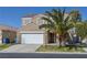 Charming two-story home with a two-car garage, palm tree, and well-maintained front yard at 5854 Heather Marie Dr, Las Vegas, NV 89110
