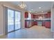 Eat-in kitchen features stainless steel appliances, tile flooring, and backyard access at 5854 Heather Marie Dr, Las Vegas, NV 89110