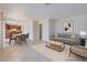 This virtually staged open-concept living space includes kitchen, dining, and lounge areas at 5854 Heather Marie Dr, Las Vegas, NV 89110