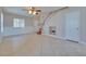 Open living area with tile floors, neutral paint, and a view of the staircase to the second floor at 5854 Heather Marie Dr, Las Vegas, NV 89110