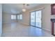 The spacious living area features tile flooring, and sliding door access to the backyard at 5854 Heather Marie Dr, Las Vegas, NV 89110