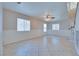 Open living space with tile flooring, neutral paint, and natural light coming from white blinds at 5854 Heather Marie Dr, Las Vegas, NV 89110