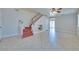 Spacious living room featuring a staircase, tile flooring, and neutral paint throughout at 5854 Heather Marie Dr, Las Vegas, NV 89110