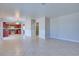 Open living space leads to a kitchen with stainless steel appliances and tile flooring at 5854 Heather Marie Dr, Las Vegas, NV 89110